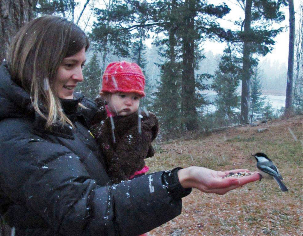 Kelly & Mikah feeding chickadees - Nov 22, 2012