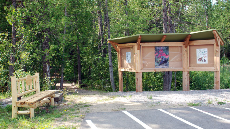 A welcoming bench sits at entrance of the NABC Nature Trail
