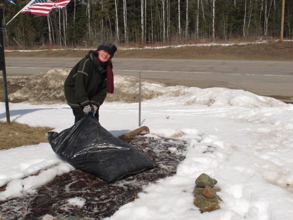 Donna Rogers tends the flower beds 