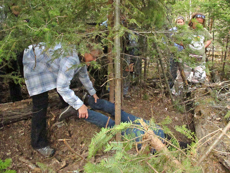 Lorie lowers Sandy into den