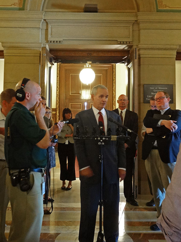 Governor Dayton speaks to reporters