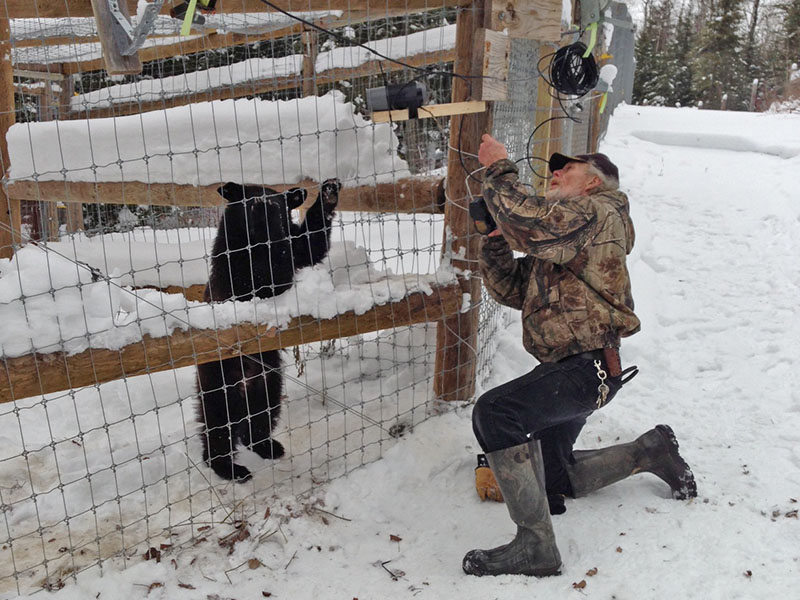 Holly supervises camera adjustments