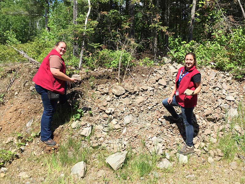 Erica and Cassie gather rocks