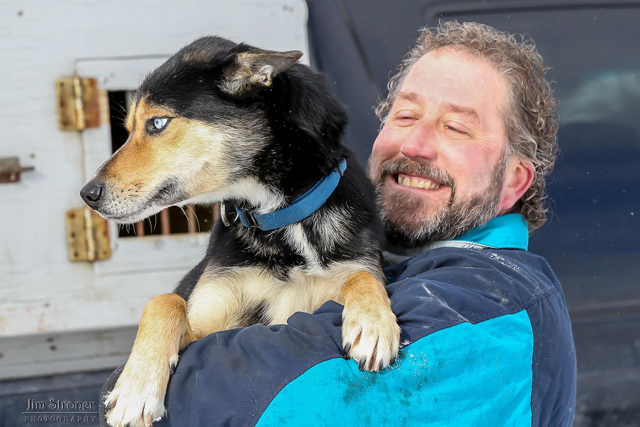 Scott Edgett with his sled dog