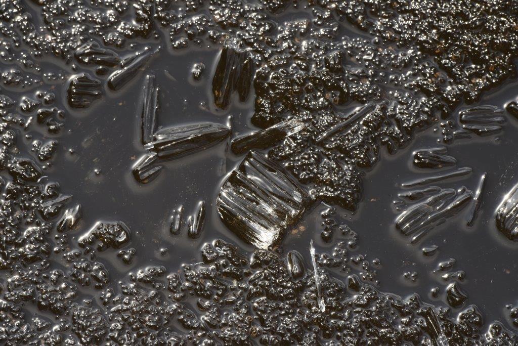 Black ice on woods lake